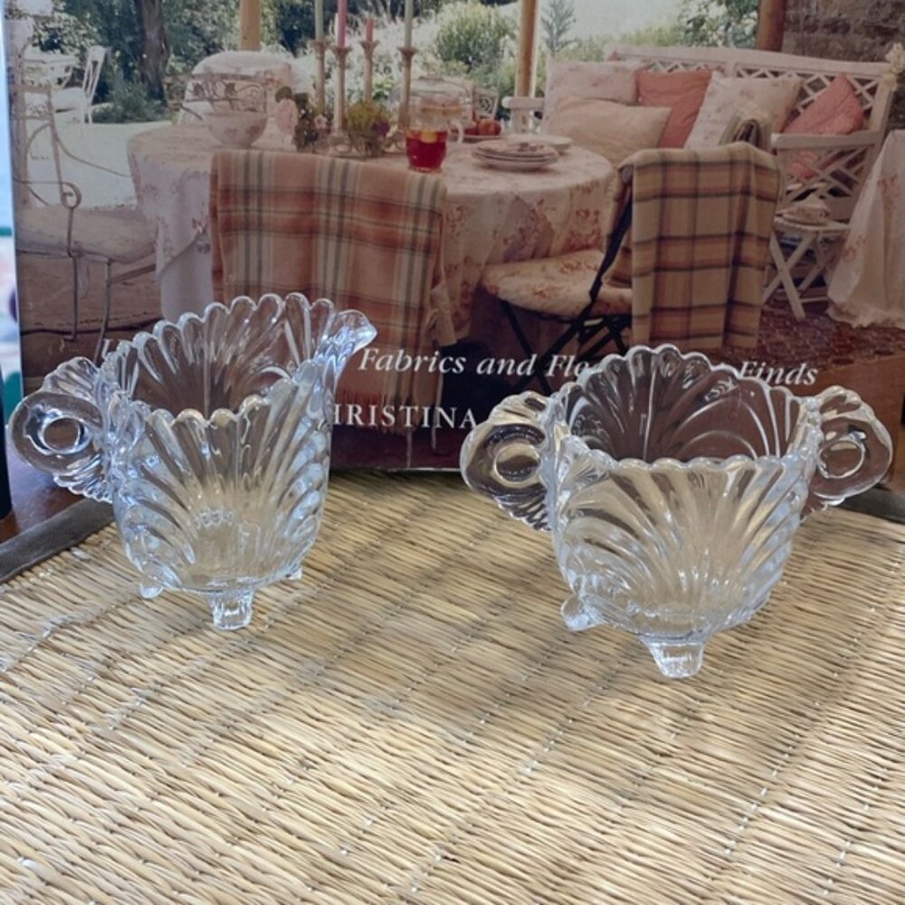 A vintage decorative footed glass cream and sugar set